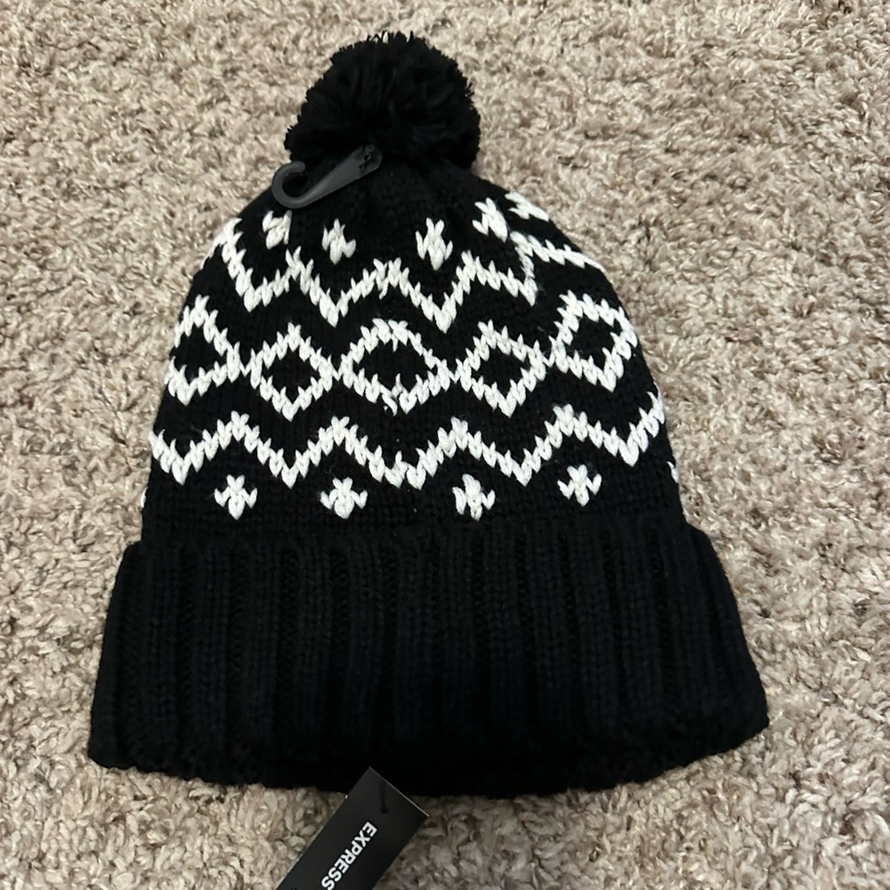 Express black and white beanie with a pom-pom